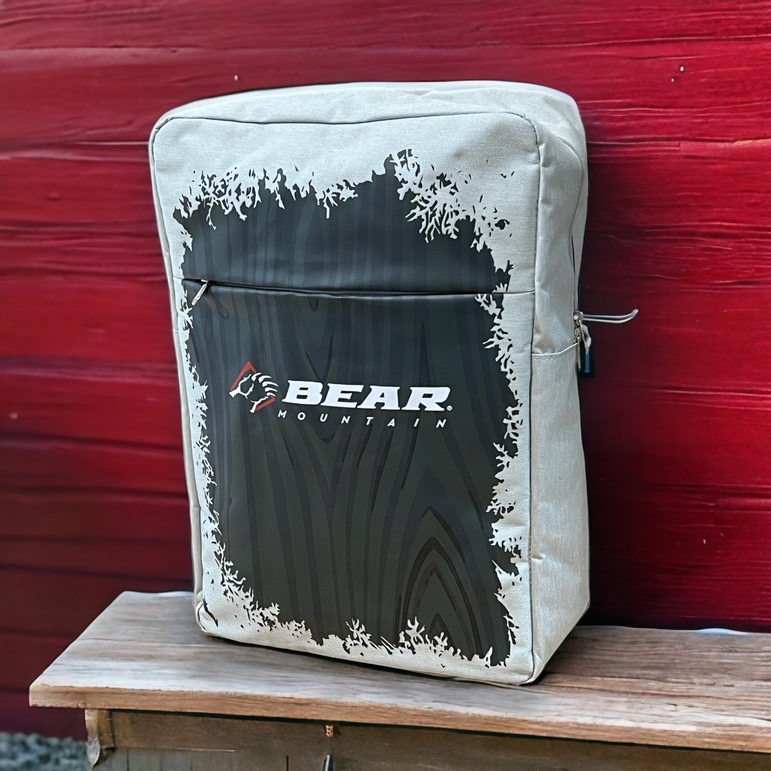 Bear Mountain frosted backpack with frosted white flakes boarder and bear claw logo on front 